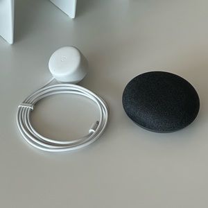 Google home white with a cord.